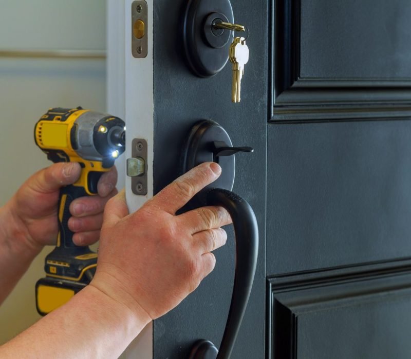 closeup-of-a-professional-locksmith-installing-a-new-lock-on-a-house-exterior-door-with-the-inside-e1696769086563.jpg